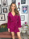 This super flattering dress features a wrap fit and tie waist with sequin iridescent finish. Style with strappy heels for a fashion forward evening look! 