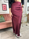 Stand out from the crowd in this beautiful skirt. Burgundy satin material, with side zip and split. It's a show stopper for sure! Dress up or down to suit the occasion.