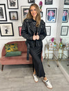 Stand out from the crowd in this beautiful skirt. Black satin material, with side zip and split. It's a show stopper for sure!
