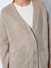 - Knitted cardigan  - Button fastenings through front  - V-neck  - Long sleeves with dropped shoulders  - Ribbed neckline, hem and cuffs  - Front patch pockets  - Relaxed fit