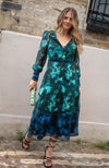 Contrasting green and blue florals decorate the base of this elegant silhouette, completed with velvet trims. The plunge neckline and full sleeves make this the perfect transitional Autumn piece, whilst the button front adds an extra detail. With a shirred back panel for ease of wear, the Babette is a perfect seasonal staple for any event.