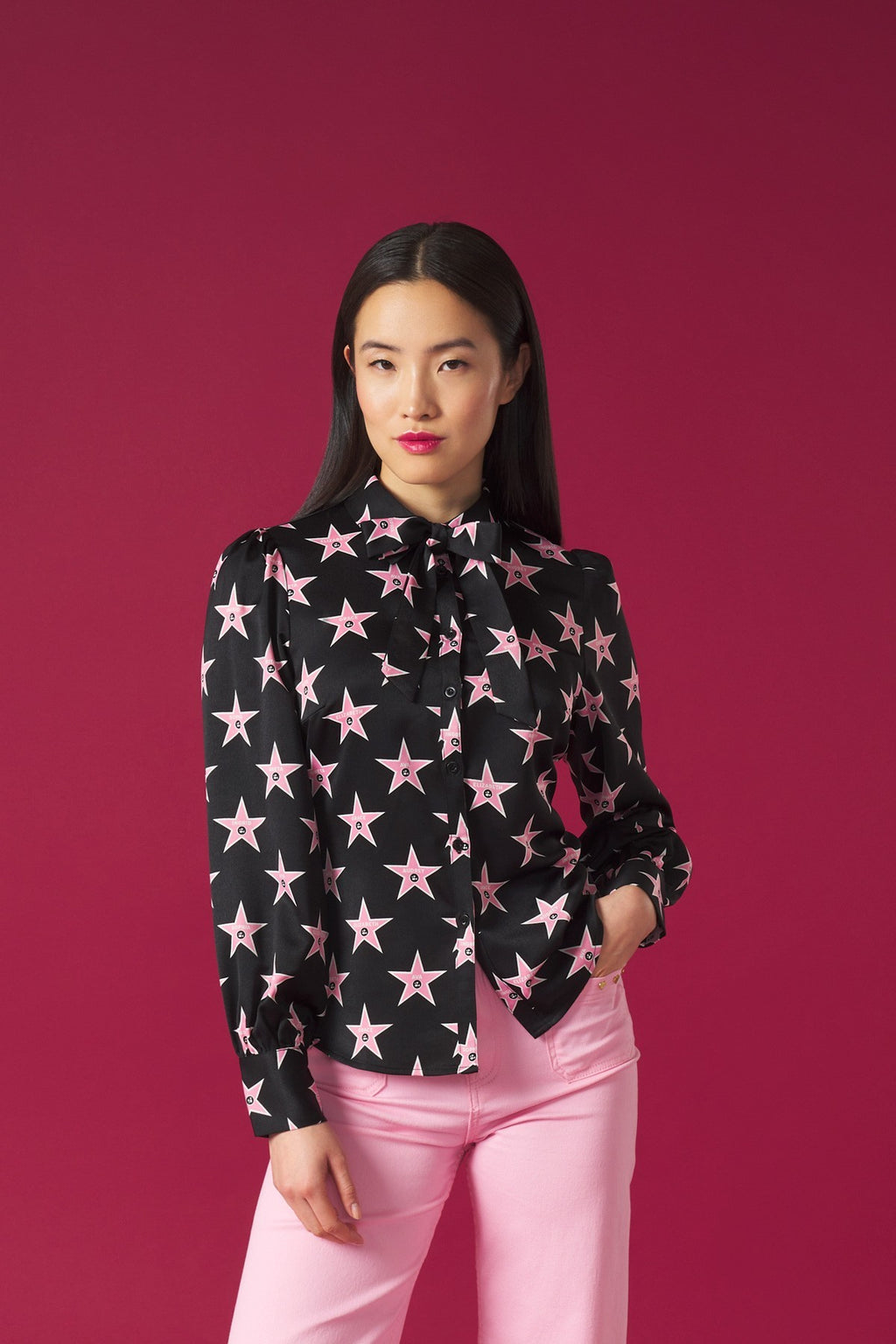 Long puff sleeve blouse. Collar and optional bow tie detail. Front button fastening.