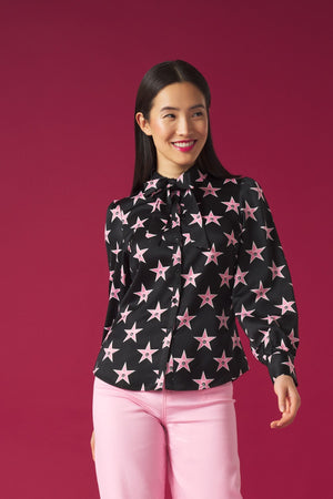 Long puff sleeve blouse. Collar and optional bow tie detail. Front button fastening.