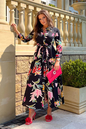 Add serious seasonal vibes style to your wardrobe this season with our new Brielle Black Floral Shirt Maxi Dress. Featuring long sleeves with tailored cuffs, a tie waist, shirt collar, and button detailing to the front. 