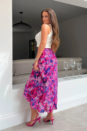 Featuring a frilled hem, wrap detailing and a thick figure skimming waistband. Pair with trainers and a high neck body for a glam casual look. 
