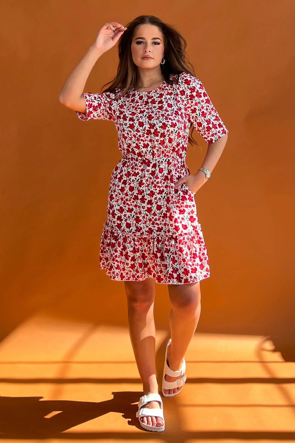 Featuring a cinched in waist, a smock hem and key hole fastening. Pair with chunky heels for a real show stopping look or trainers for casual vibe.