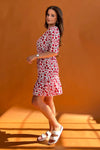 Featuring a cinched in waist, a smock hem and key hole fastening. Pair with chunky heels for a real show stopping look or trainers for casual vibe.