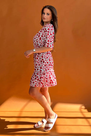 Featuring a cinched in waist, a smock hem and key hole fastening. Pair with chunky heels for a real show stopping look or trainers for casual vibe.