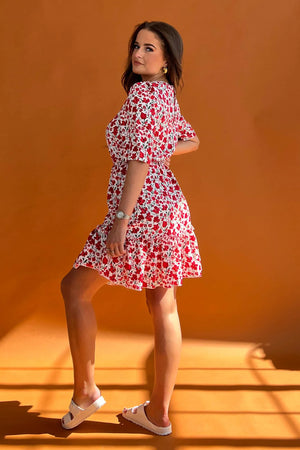 Featuring a cinched in waist, a smock hem and key hole fastening. Pair with chunky heels for a real show stopping look or trainers for casual vibe.