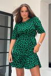 Featuring a cinched in waist, a smock hem and key hole fastening. Pair with chunky heels for a real show stopping look or trainers for casual vibe.