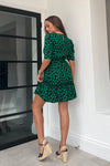 Featuring a cinched in waist, a smock hem and key hole fastening. Pair with chunky heels for a real show stopping look or trainers for casual vibe.