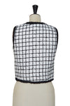 Sleeveless tweed vest with piping