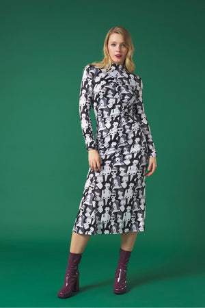 Midi dress with turtleneck. Long sleeves. Gathering detail. Back button fastening.