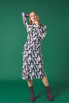 Midi dress with turtleneck. Long sleeves. Gathering detail. Back button fastening.
