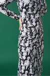 Midi dress with turtleneck. Long sleeves. Gathering detail. Back button fastening.