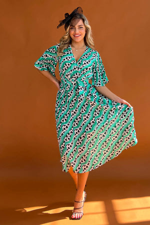 Featuring a wrap over neckline &amp; delicate pleated angel sleeves, this midi dress cinches you in at the waist with a large belt with buckle detail creating the perfect silhouette. The invisible zip fastening is perfect for easy on and the pleated midi skirt creates a soft &amp; feminine vibe.
