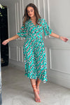 Featuring a wrap over neckline &amp; delicate pleated angel sleeves, this midi dress cinches you in at the waist with a large belt with buckle detail creating the perfect silhouette. The invisible zip fastening is perfect for easy on and the pleated midi skirt creates a soft &amp; feminine vibe.