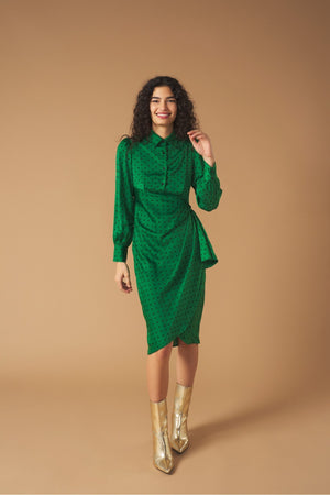 Long sleeve shirt dress. Wrap skirt. Ruffle detail on the skirt. Front button fastening and side zip.