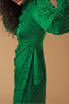 Long sleeve shirt dress. Wrap skirt. Ruffle detail on the skirt. Front button fastening and side zip.
