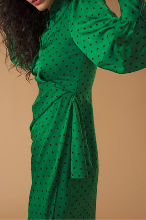 Long sleeve shirt dress. Wrap skirt. Ruffle detail on the skirt. Front button fastening and side zip.