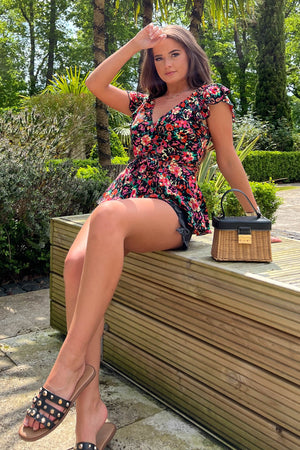  Featuring a belt, wrap neckline and beautiful print, this top is the perfect addition to your everyday wardrobe. Pair with jeans or shorts for an effortless look.