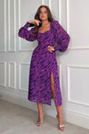 Featuring a sweetheart neckline, long sleeves, cinched in waist and a side slit. Pair with heels for a night out and boots for a casual event 