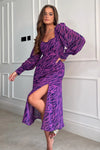 Featuring a sweetheart neckline, long sleeves, cinched in waist and a side slit. Pair with heels for a night out and boots for a casual event 