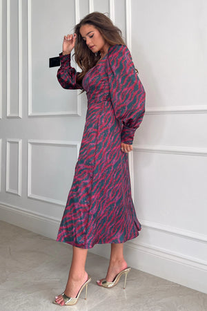 Add a bold print to your wardrobe with our beautiful Katie Sweetheart Long Sleeve Midi Dress. Featuring a sweetheart neckline, long sleeves, cinched in waist and a side slit. Pair with heels for a night out and boots for a casual event.