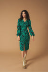 Midi V-neck dress with vent detail on the front. Long puff sleeves. Back zip fastening.