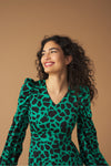 Midi V-neck dress with vent detail on the front. Long puff sleeves. Back zip fastening.