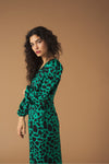 Midi V-neck dress with vent detail on the front. Long puff sleeves. Back zip fastening.