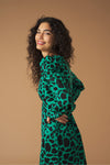 Midi V-neck dress with vent detail on the front. Long puff sleeves. Back zip fastening.