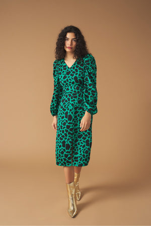 Midi V-neck dress with vent detail on the front. Long puff sleeves. Back zip fastening.