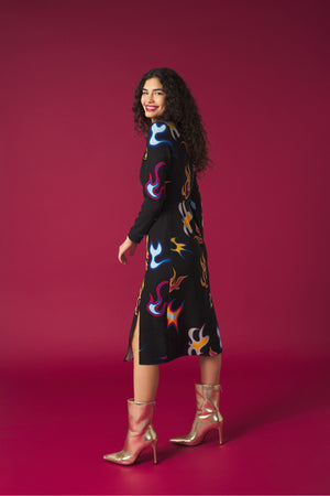 Round neck dress with long sleeves. Front knot detail. Front vent. Back zip fastening.