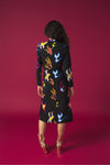 Round neck dress with long sleeves. Front knot detail. Front vent. Back zip fastening.
