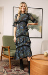 Hand-designed ditsy florals bloom across the dark base in powerful blue, green and orange tones. With tiered skirt and bell sleeves, this figure hugging pencil midi style dress is undeniably flattering. Finished with lace trims, dress up or down for the perfect transitional piece this Autumn.