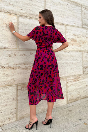 Crafted with our premium woven fabric in a beautiful purple leopard print, this simple styling is super flattering with its bust seam detail to sculpt your silhouette and on trend high split. The angel sleeves add a touch of elegance and the elasticated back waist will cinch in your hourglass figure. Style this look with heels and step in style at any occasion this season