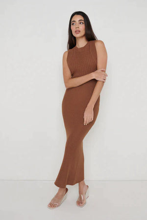 Designed with a sleek contrast crochet knit top panel. This low back Maxi dress has a slim bodycon silhouette that subtly flutes at the hem. Perfect for summer nights pair with a sandal or barely their heel for the elevated look.