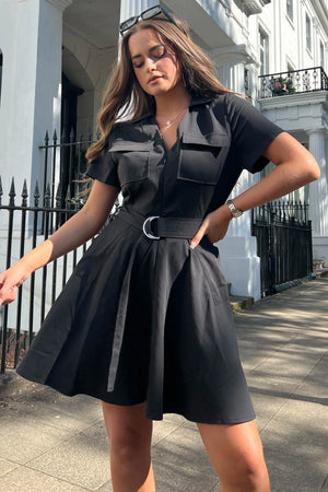 Equipped with belt detail, pockets, short sleeve, and skater skirt, this dress is perfect for making a bold fashion state