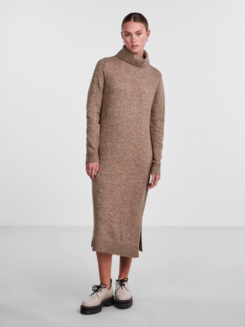 - Turtleneck  - Dropped shoulders  - Long sleeves  - Ribbed trims  - Side slit details  - Midi length  - Relaxed fit