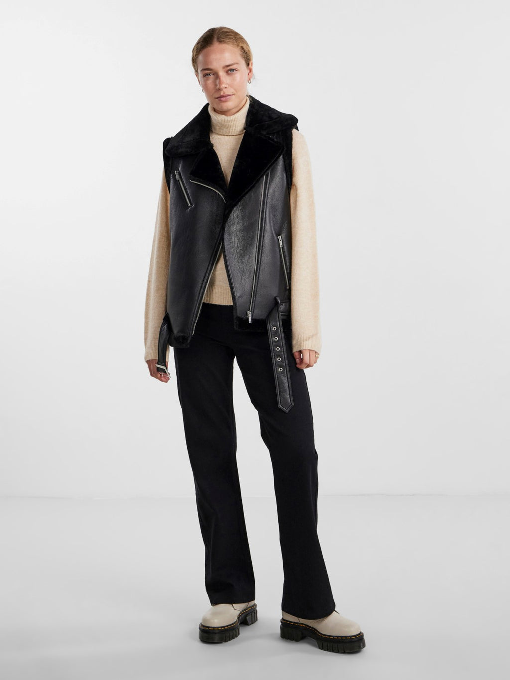 - Faux leather gilet  - Asymmetric zip-up front  - Oversized faux fur lapel  - Sleeveless design with faux fur trim  - Zipped chest pocket  - Zipped side pockets  