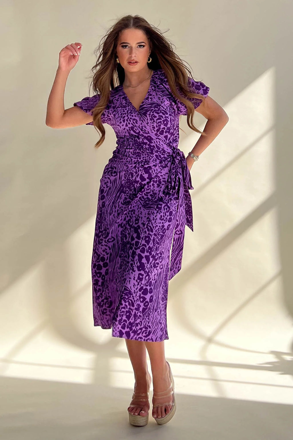Its wrap design, floral pattern and midi length make it perfect for any occasion. 