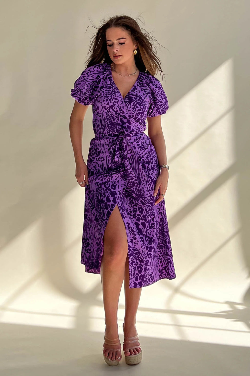 Its wrap design, floral pattern and midi length make it perfect for any occasion. 
