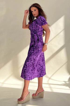 Its wrap design, floral pattern and midi length make it perfect for any occasion. 