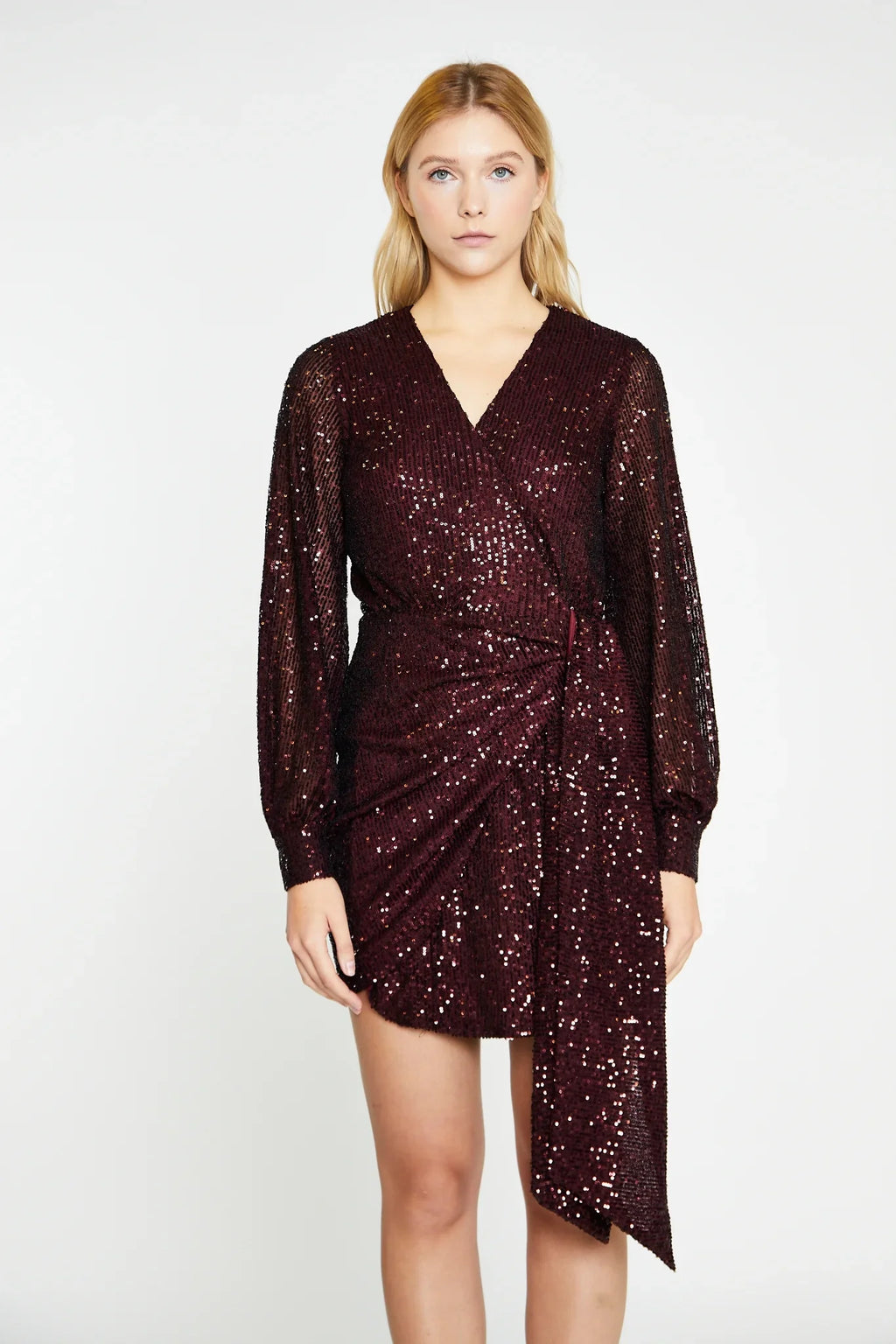 Sequin mini dress featuring an ultra flattering wrap-front silhouette and cuffed long sleeves, you'll look effortlessly stylish and feel comfortable all night long.