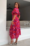 The form-flattering style contours your curves and features 3/4 sleeves with an elasticated cuff creating a subtle puff styling, and thigh high split for a gorgeous twist on a staple dress