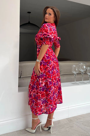 The form-flattering style contours your curves and features 3/4 sleeves with an elasticated cuff creating a subtle puff styling, and thigh high split for a gorgeous twist on a staple dress