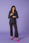 This stunning fitted tailored blazer is a showstopper, paired with matching flared trousers.   With shoulder pads and double breast.   Model wears S. 