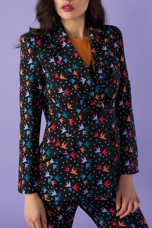This stunning fitted tailored blazer is a showstopper, paired with matching flared trousers.   With shoulder pads and double breast.   Model wears S. 