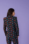This stunning fitted tailored blazer is a showstopper, paired with matching flared trousers.   With shoulder pads and double breast.   Model wears S. 